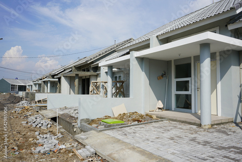 A collection of many houses neatly lined up with subsidies from the Indonesian government, which are small in size at low prices which are still under construction and under development. photo