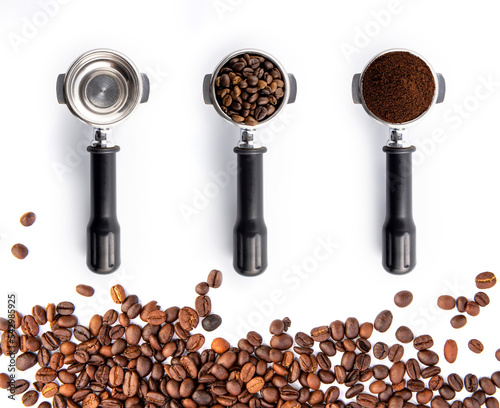 Brown roasted coffee beans and powder on the potta filter isolated on white background. photo