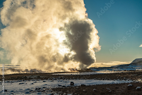 fumarole of Hverir, geothermal area at the foothill of Namafjall, during winter sunrise, with sun covered by the steam