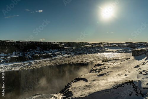 dettifoss waterfall in iceland with liffs covered with snow