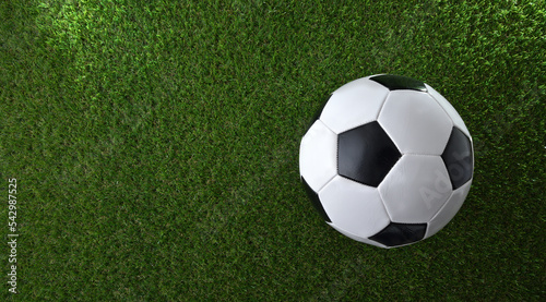 Classic soccer ball on synthetic grass top view
