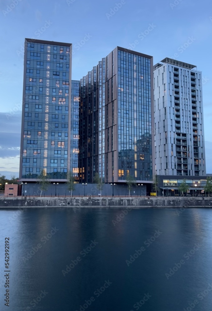 Modern buildings by the waterfront at twilight. Taken in Salford Quays England. 