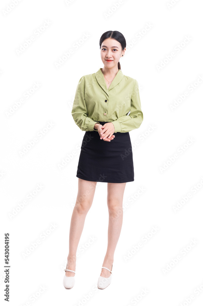 Fototapeta premium A business woman in a green suit and a black skirt against a white background