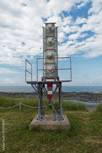 фотографія A stack of foghorn on a concrete based