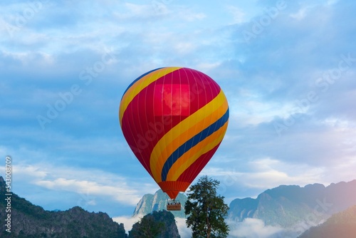 Hot air balloon flying with view mountain landscape in Vang Vieng Laos