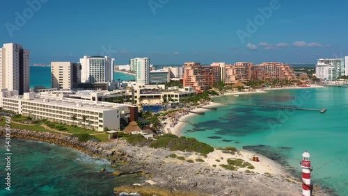 Aerial view of Cancun and Punta Cancun lighthouse. View from a height of the waterfront and the hotel area of ​​Cancun. In the foreground is a Punta Cancun lighthouse and the Hyatt Ziva Cancunt Hotel. photo