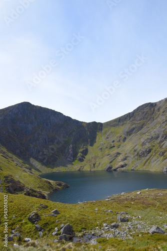 Fototapeta Naklejka Na Ścianę i Meble -  a view looing down in the crater of Cadair Idris with a mountain view behind it