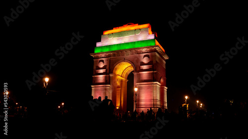 INDIA GATE DELHI WITH FLAG FLYING India Gate, New Delhi, indian culture gate landmark Red Fort is a historic fort UNESCO world Heritage Site at Delhi. On Independence day, the Prime Minister hoists In photo