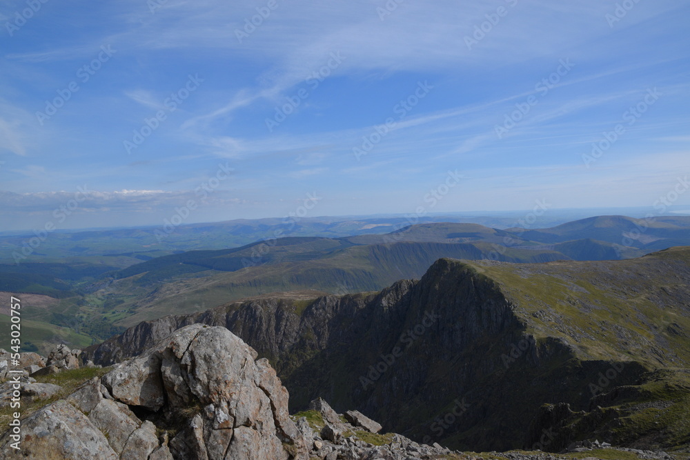 Fototapeta premium a view looing down in the crater of Cadair Idris with a mountain view behind it