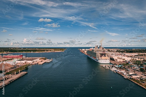 Drone shot of the blue sea and a big ship docked in the port of Cape Canaveral, Florida photo