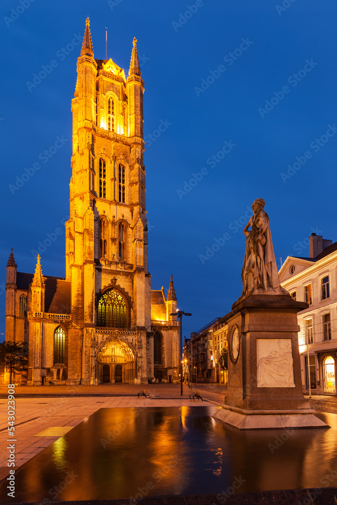 Obraz premium Monument to Jan Frans Willems and Saint Bavo Cathedral in the evening. Sint-Baafsplein, Flanders, Ghent, Belgium