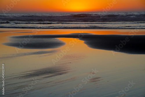 Beautiful sandy beach right after sunset                              