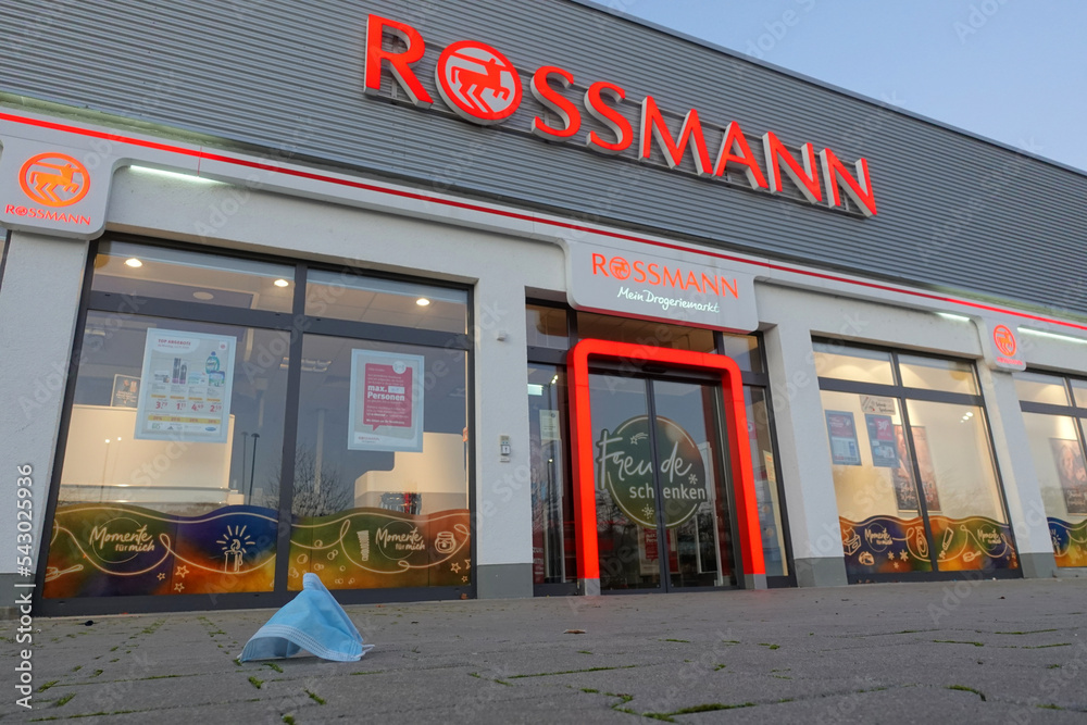 Entrance of the Rossmann company, mouth and nose mask is on the floor, the  windows are decorated for Christmas. Wolfschlugen, Germany. Stock Photo |  Adobe Stock