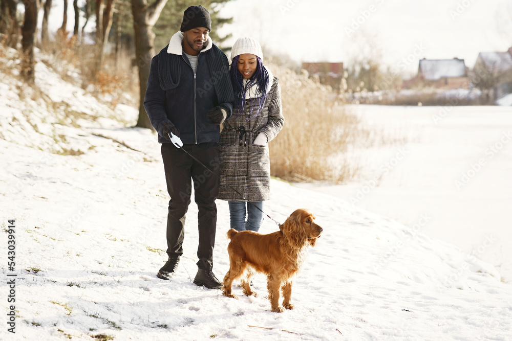 African american couple in a winter forest