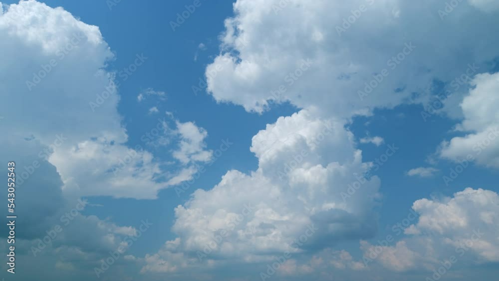 Cumulonimbus cloud and blue sky. Beautiful summer cumulonimbus cloud flowing through blue sky. Timelapse.