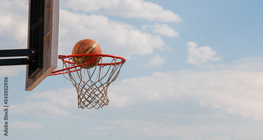 A ball flies in a basket,goal,2 points in basket-ball