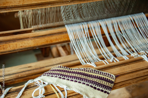 Old loom in a country house. Close-up. Antique household utensils