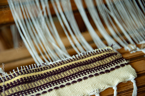 Old loom in a country house. Close-up. Antique household utensils
