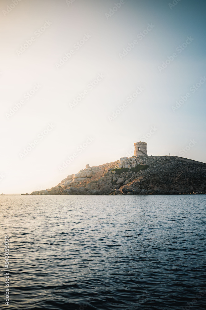 Omigna Tower at sunset in Corsica, France. Genoese tower photography in vertical format. Cargese, Corse Omigna Tower at sunset in Corsica, France. Genoese tower photography in vertical format. Cargese, Corse
