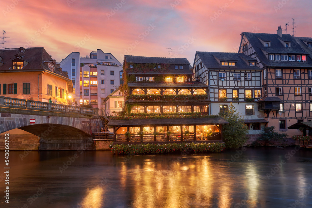 Nocturnal capture of houses on the banks of the river Ill in the city of Strasbourg, France.