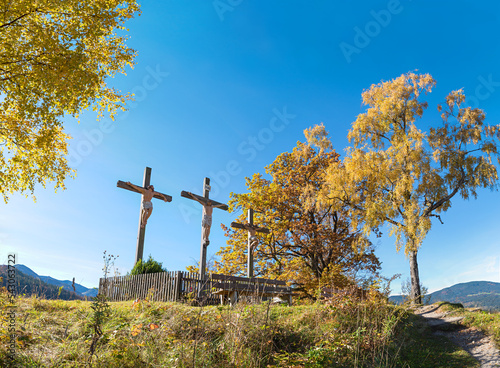 calvary hill with three crosses, crucifixion scene in autumnal landscape, Fischbachau photo