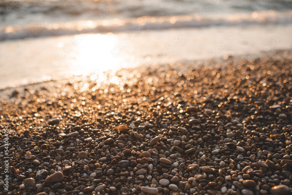 Obraz premium Background of sea shore over sun set with lights. Nature texture. Selective focus.