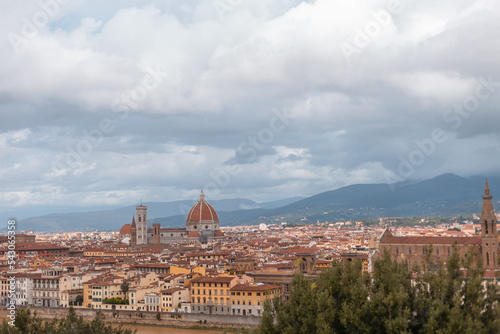 Beautiful amazing city with ancient houses and a cathedral in the mountains in Florence, Italy on a cloudy day