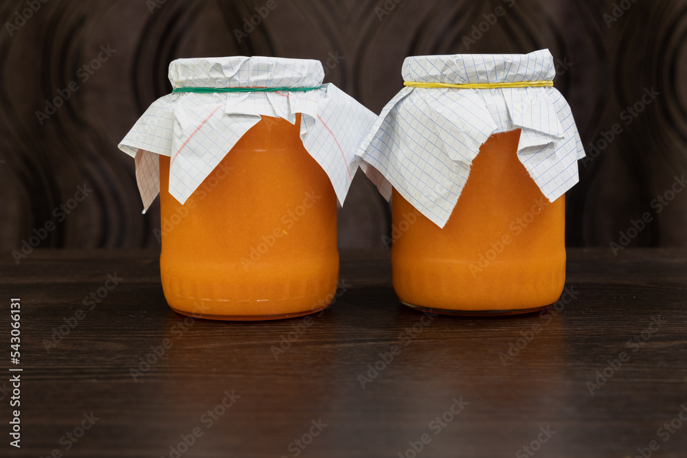 Fresh sea buckthorn fruits rubbed with sugar in glass jars Fresh sea buckthorn fruits rubbed with sugar in glass jars