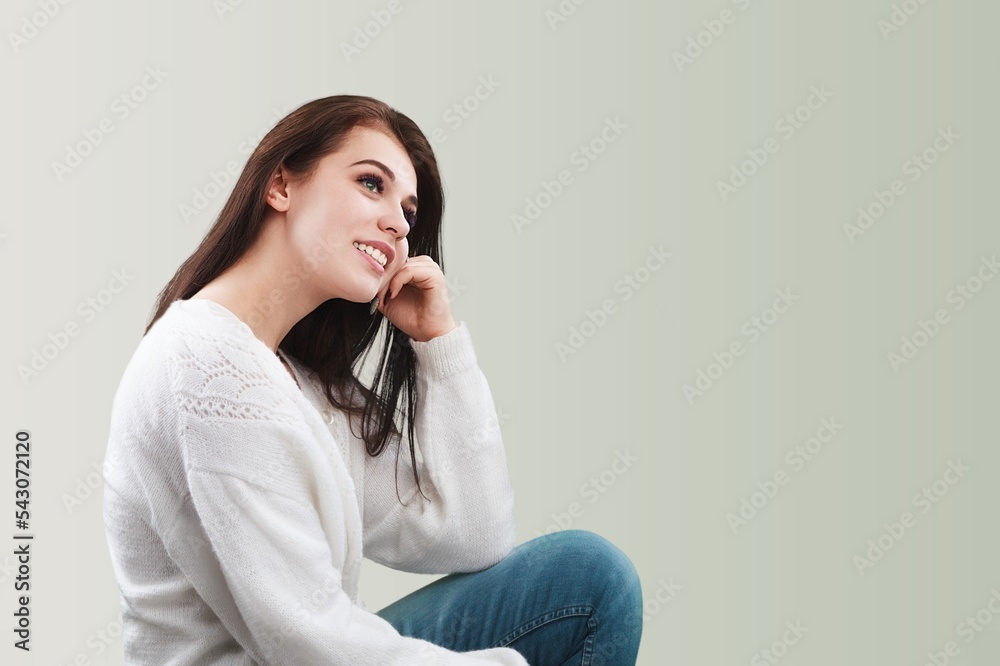 A woman model smiling and posing on background A woman model smiling and posing on background