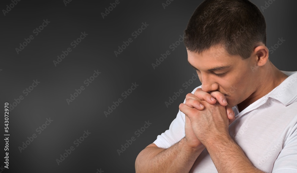 A man pray on dark background. Religion concept A man pray on dark background. Religion concept