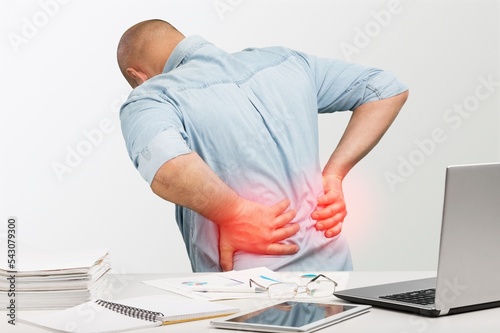 Person with health problems, back pain photo