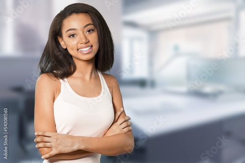 Free Download Happy young woman posing in office room indoors - GFXLoad