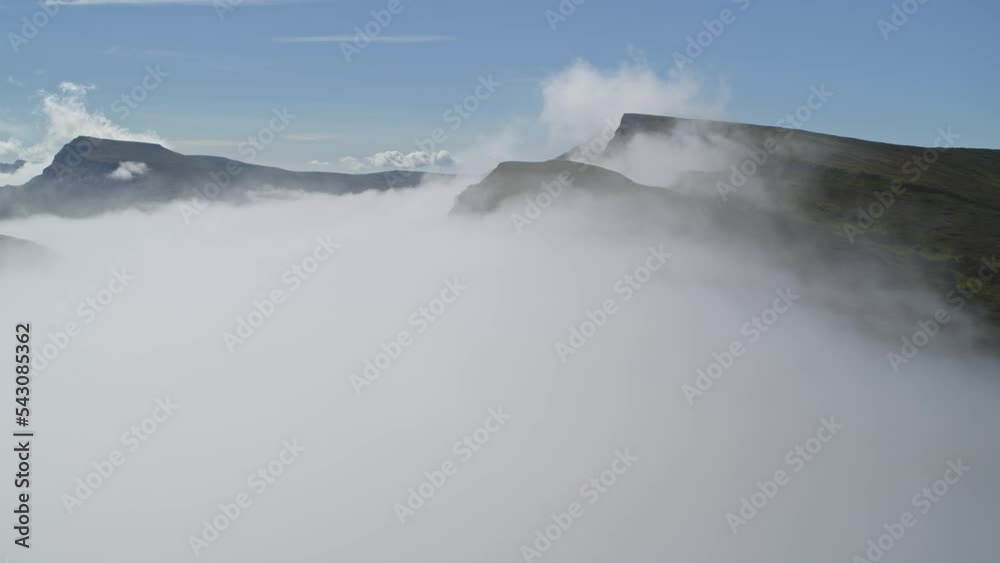Scenic aerial flyover view of fog at The Quiraing / Portree, Scotland Scenic aerial flyover view of fog at The Quiraing / Portree, Scotland