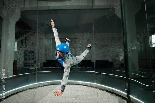 A woman flies in a wind tunnel. Free fall simulator.