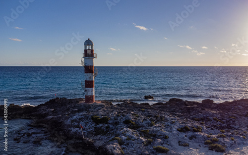lighthouse on the coast during dawn