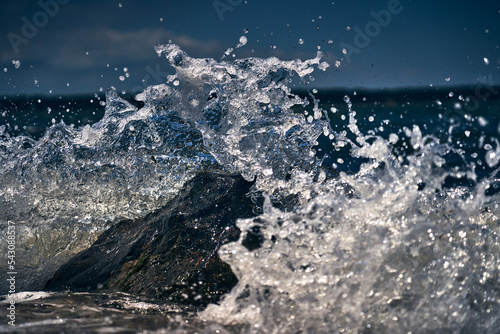 Waves crash on the north shore rocks of long island new york