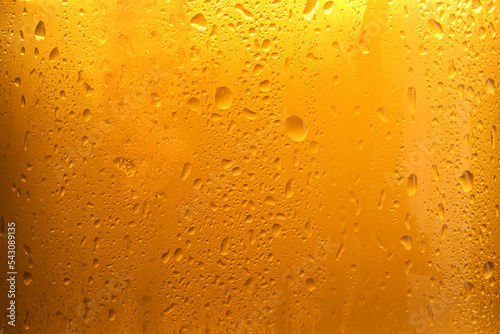 Bilde på lerret Glass of tasty cold beer with condensation drops as background, closeup