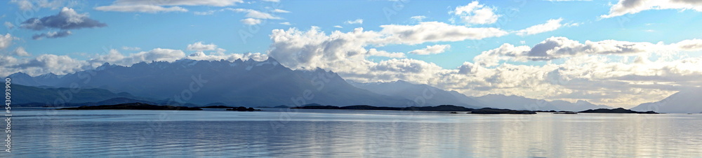 Panorama of the Beagle Channel, outside of Ushuaia, Argentina, under a cloudy, afternoon sky