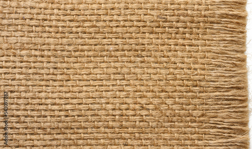 Texture of brown burlap  rough fabric with fibers for bags  macro