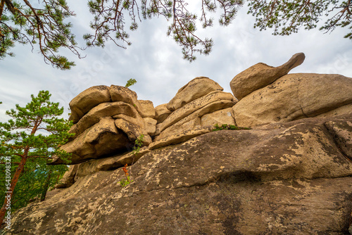 Magnificent rocks of the Arakul shikhan of the granite rock massif of the Middle Urals on a summer day photo