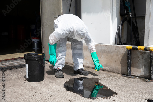 people cleaning chemical leak absorbent photo