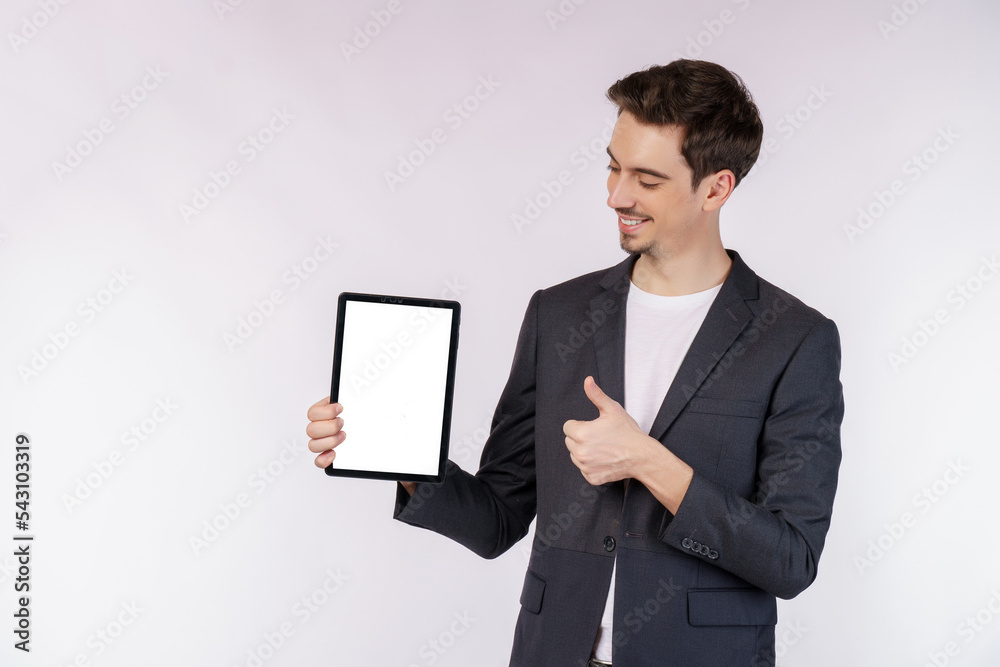 Portrait of attractive cheerful businessman using device app searching web isolated over white color background Portrait of attractive cheerful businessman using device app searching web isolated over white color background