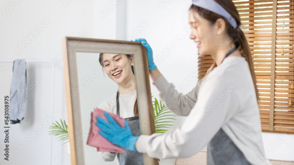 Beautiful housewife is cleaning things and Wipe the mirror in her dressing room, Big cleaning, Housework, Daily routine ,Removes germs and dirt and deep stains, Spray alcohol, Clean up on weekends. Beautiful housewife is cleaning things and Wipe the mirror in her dressing room, Big cleaning, Housework, Daily routine ,Removes germs and dirt and deep stains, Spray alcohol, Clean up on weekends.