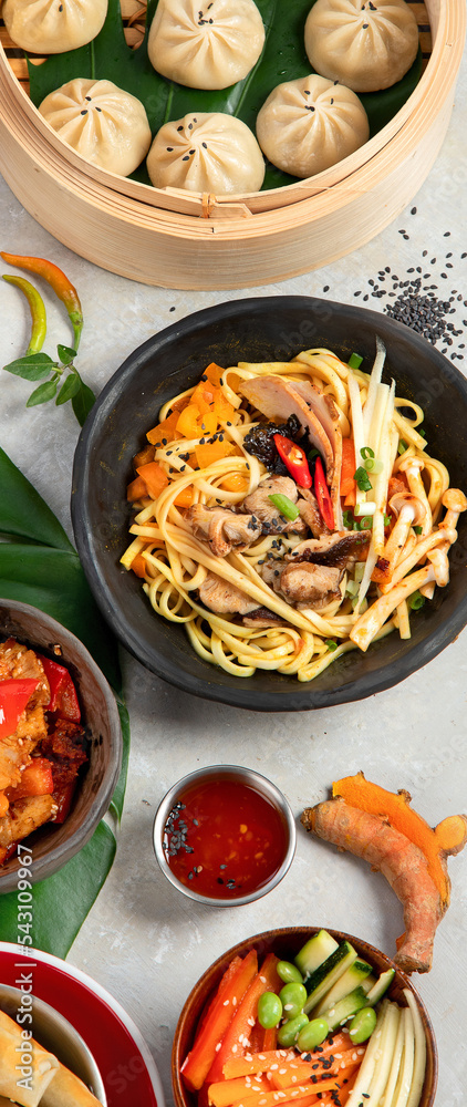 Assorted Chinese food on dark background. Asian food concept. Top view. Assorted Chinese food on dark background. Asian food concept. Top view.