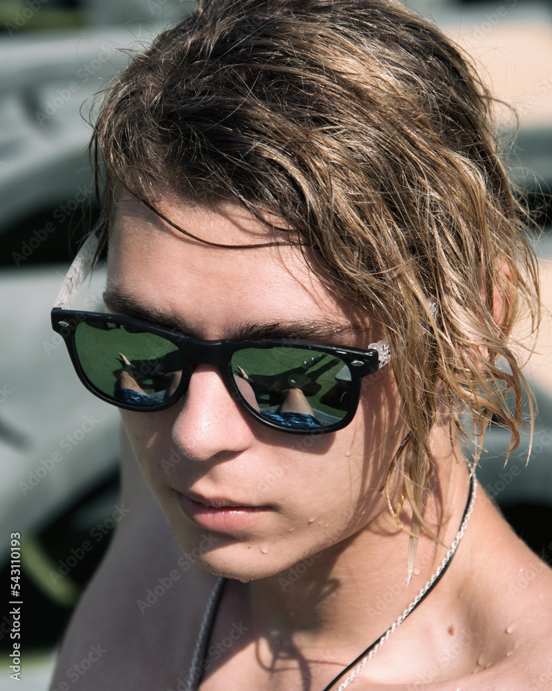 Young attractive guy on vacation is relaxing in the pool. Young attractive guy on vacation is relaxing in the pool.