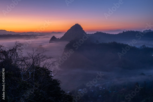 View of flowing fog on mountain tropical rainforest in the morning