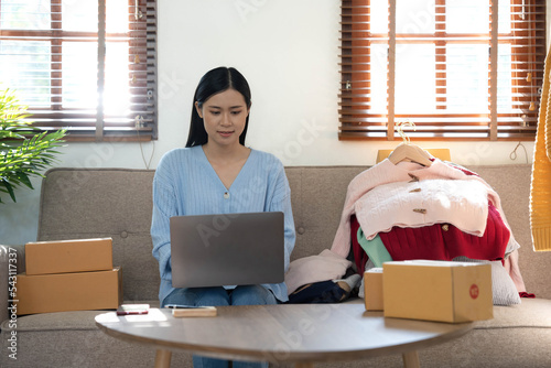 Startup small business entrepreneur SME, asian woman packing box. Portrait of young Asian small business owner in home office, online sell marketing delivery, SME e-commerce telemarketing concept