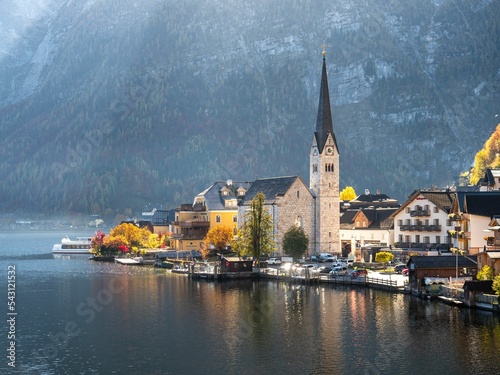 Evangelical parish church and old buildings on the Hallstatter See lakeshore in Hallstatt, Austria photo