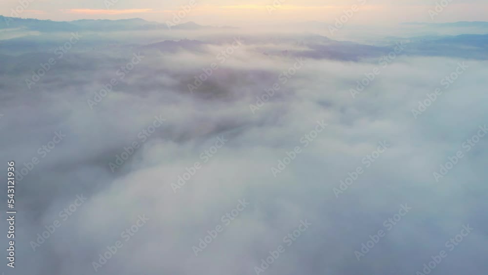 Aerial view over dense fog and beautiful mountains during sunrise. Landscape of tropical rainforest in winter. Nan Province, Northern Thailand. travel and nature concept. 4K
Aerial view over dense fog and beautiful mountains during sunrise. Landscape of tropical rainforest in winter. Nan Province, Northern Thailand. travel and nature concept. 4K