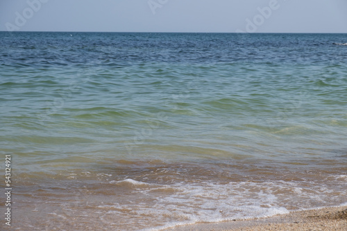 Coastal landscape and seascape. A blue horizon where cloudless sky and blue sea meet. Marine coastal landscape with a horizon and a clear dark blue sky. Background. Ocean